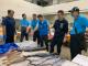 圖2 石慶豐局長和岡山魚市場總經理沈益平與攤商互動